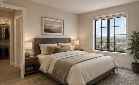 One-bedroom bedroom with a walk-in closet to one side and a window